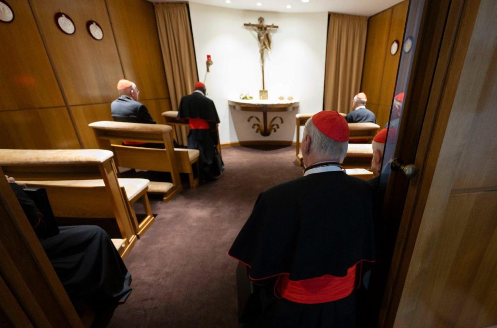 In a chapel adjacent to the New Synod Hall, cardinals offer prayers before the Blessed Sacrament. (Source: Vatican Media)